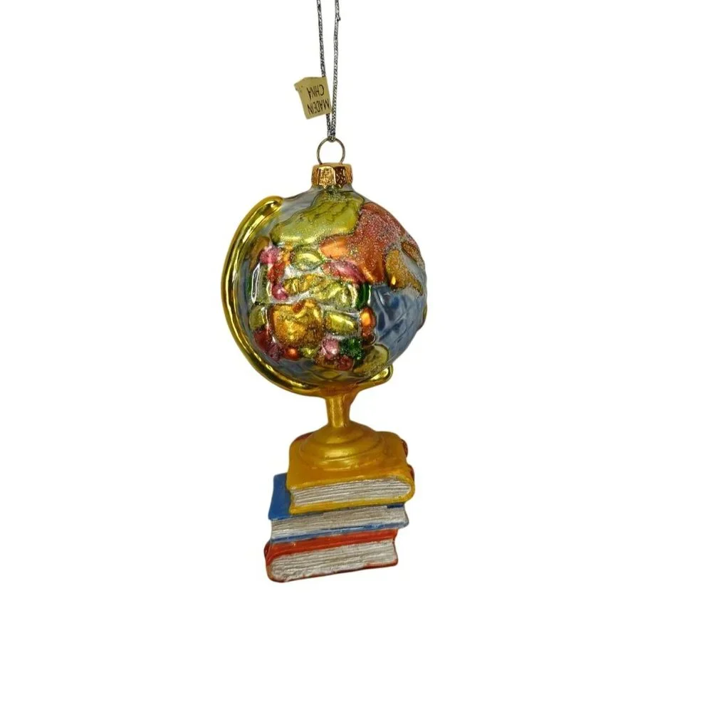 Glass Globe‎ Ornament On Book Stack With Apple & Gold Accents